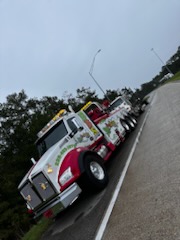 shed mover with portable building on flatbed